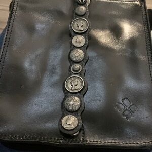Patricia Nash black leather cross over bag with adjustable shoulder strap.